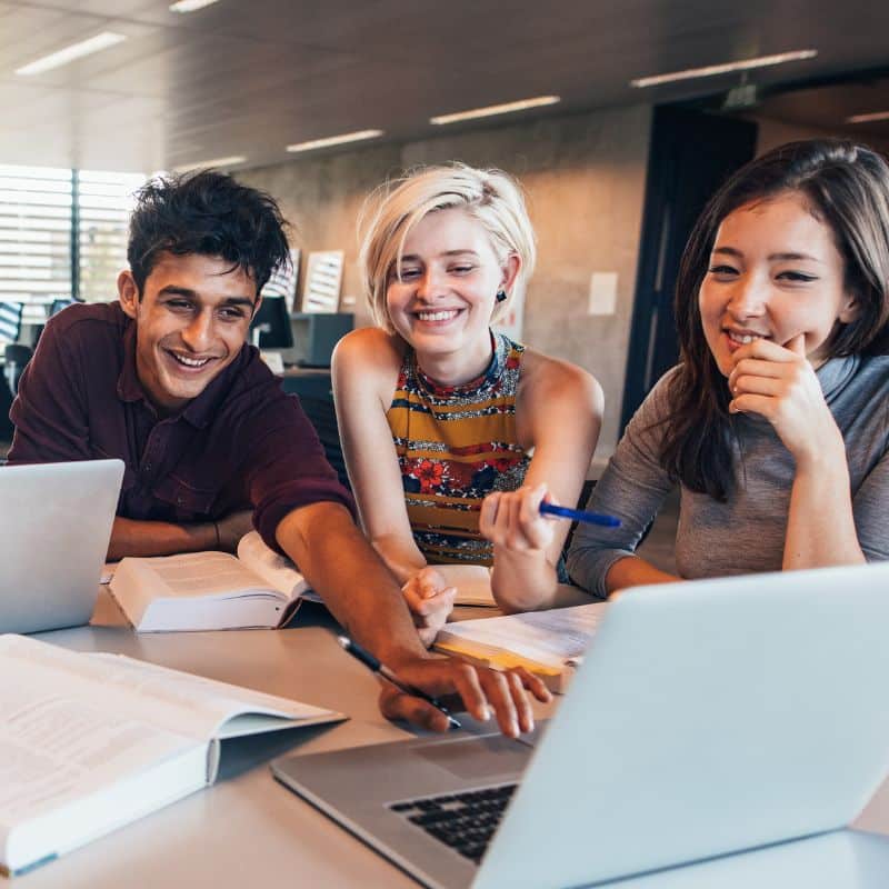 three Students at a computer